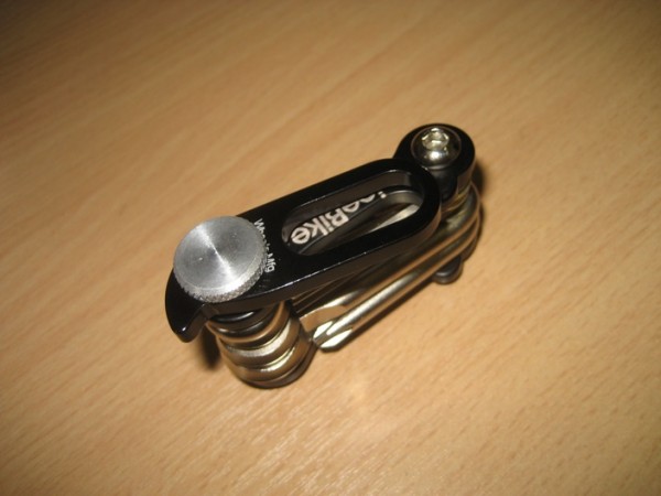 A cute multitool from Wheels Mfg - the thing attached to the side with that knurled thumbscrew is a universal emergency replaceable dropout hanger (it attaches to your bike via the rear QR nut). Dave could have done with one of these on our last night ride!