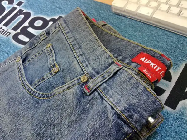 Alpkit's water resistant Jeanius jeans have finally made it into proper production.