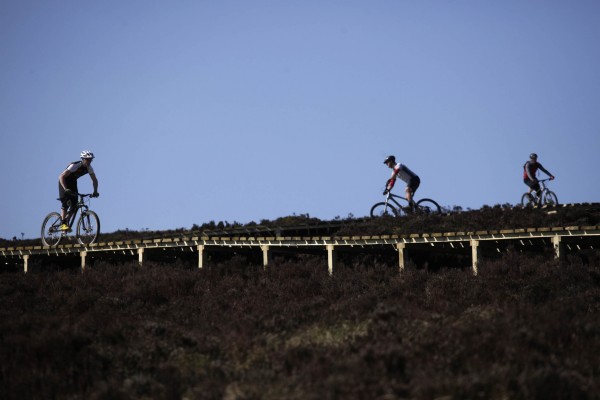 Bikers trying out the red trail in Kielder Water & Forest Park and on the 1.2 kilometre timber `fly-over’ - the longest of its kind in England - built to speed riders over boggy terrain. Pic by Mark Pinder.