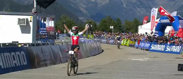 Schurter finishes arms raised