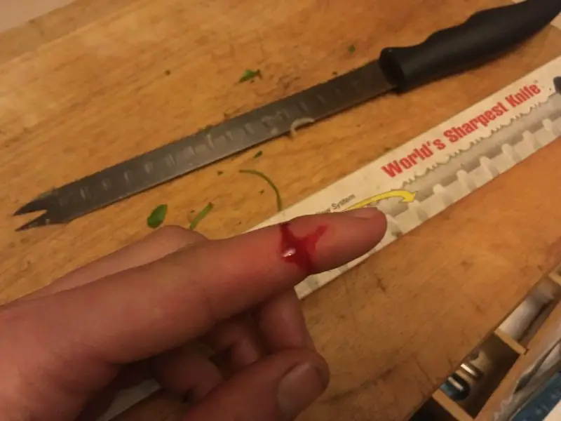 bloody finger cut knife