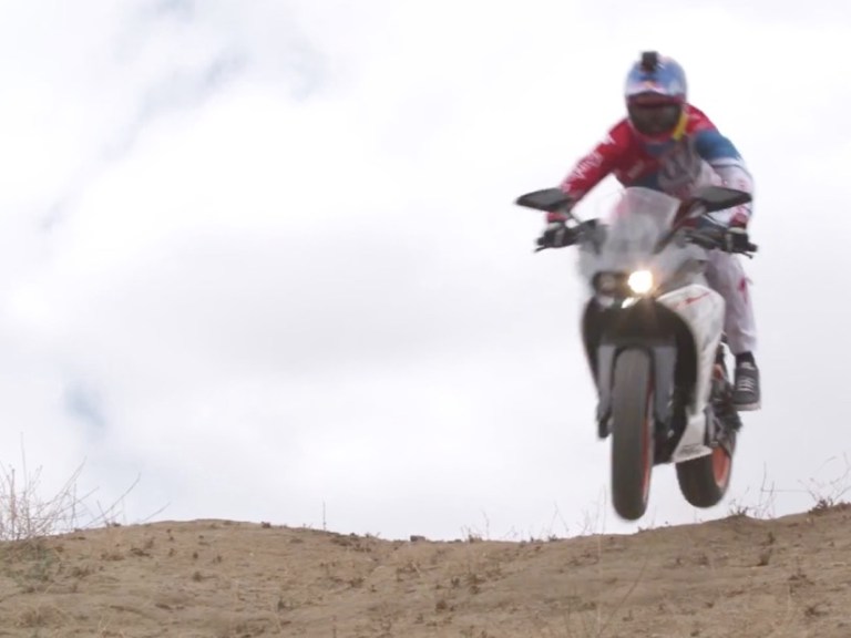 Aaron Gwin rides a KTM motorcycle downhill, CHAINLESS