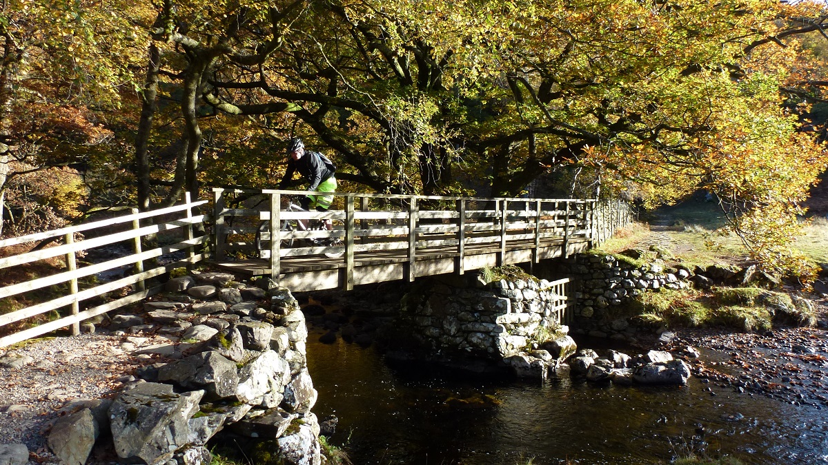 Riding over bridge UK Mountain bike adventure Singletrack Magazine