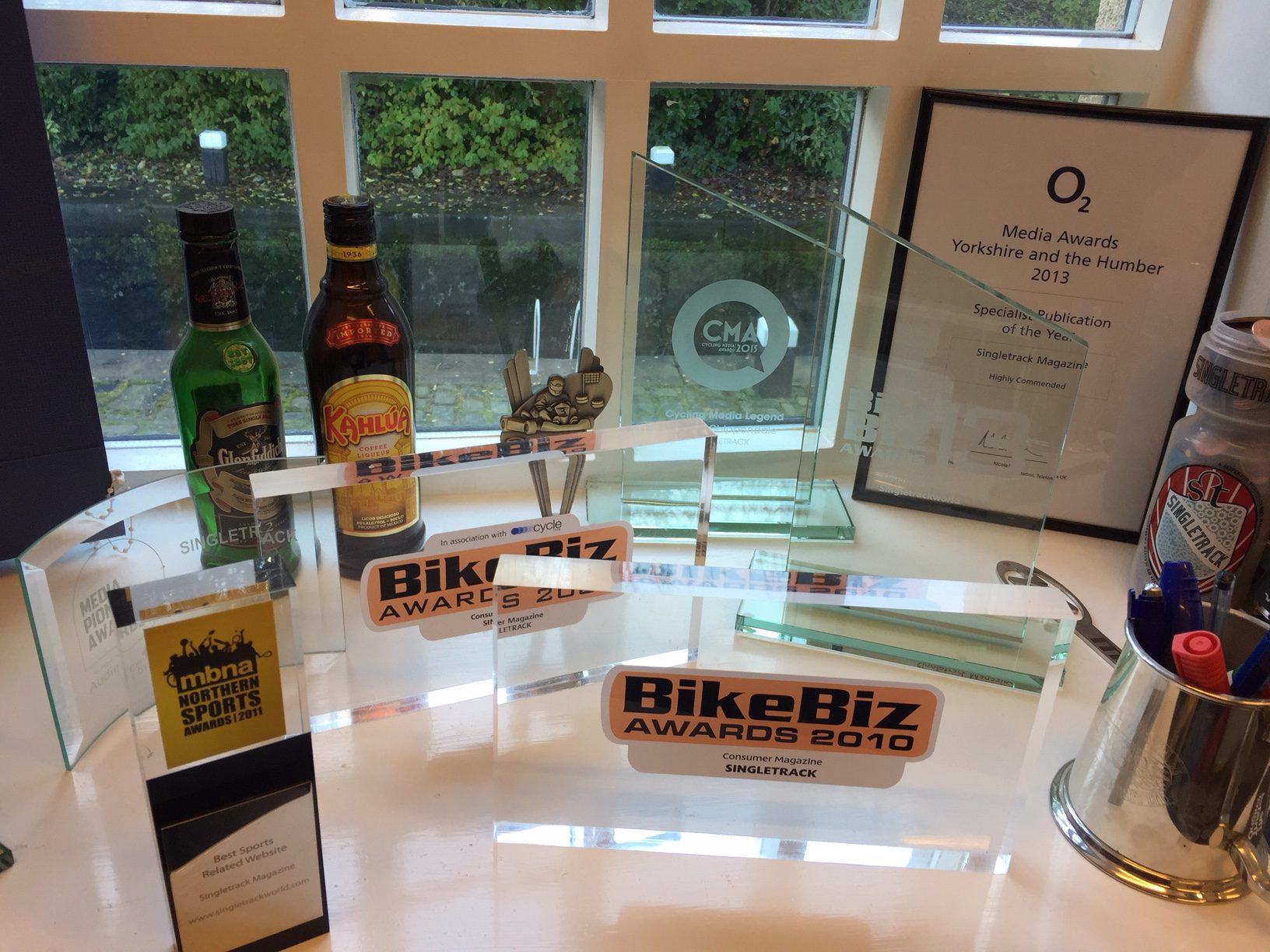 The Singletrack trophy and tankard of pens windowsill.