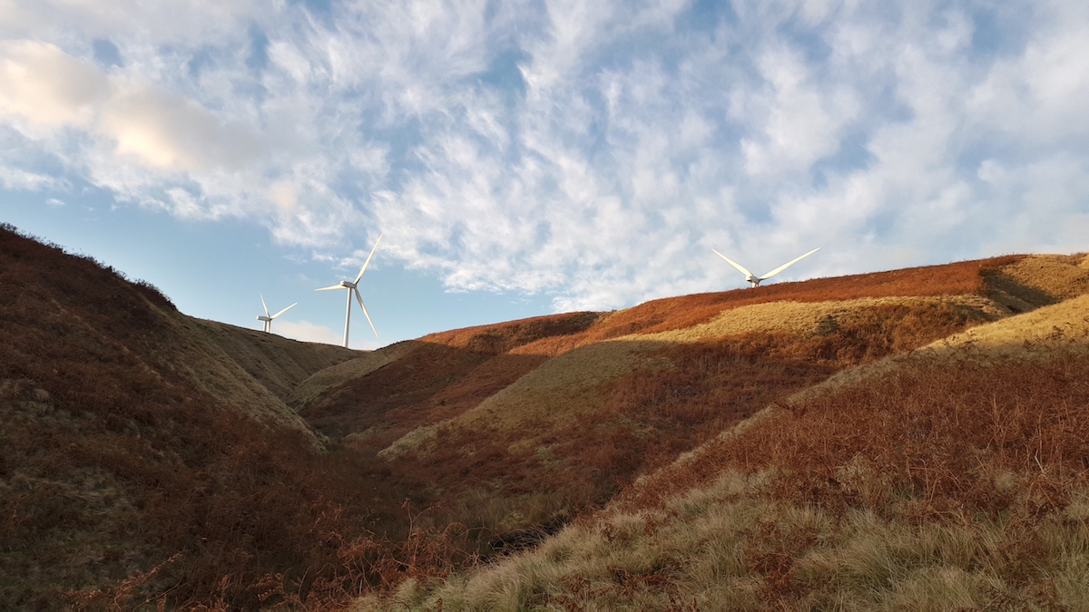 windmills calderdale sun blue sky moors