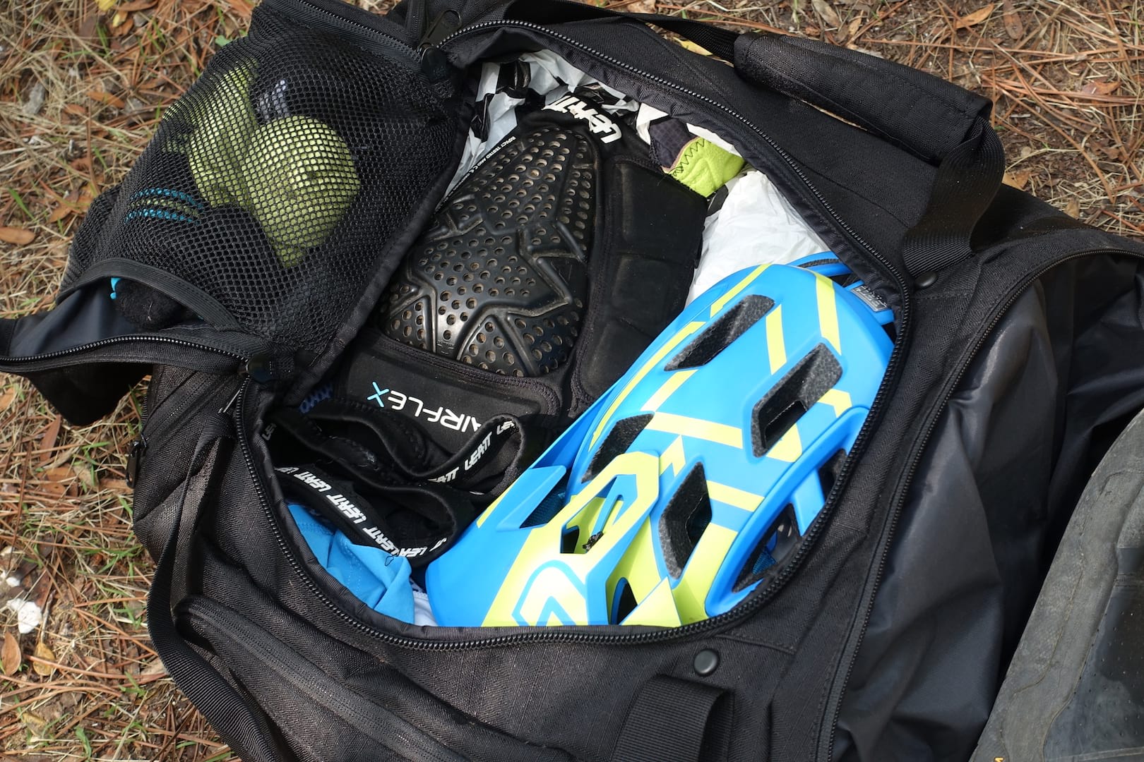 dakine gear bag duffel leatt helmet knee pads