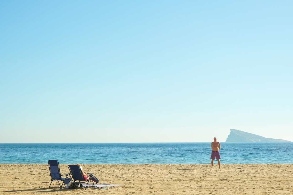 benidorm beach man standing in shorts