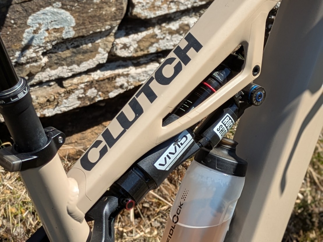 Close-up of the Moustache Clutch bike frame, showcasing the branding and RockShox Vivid air shock.
