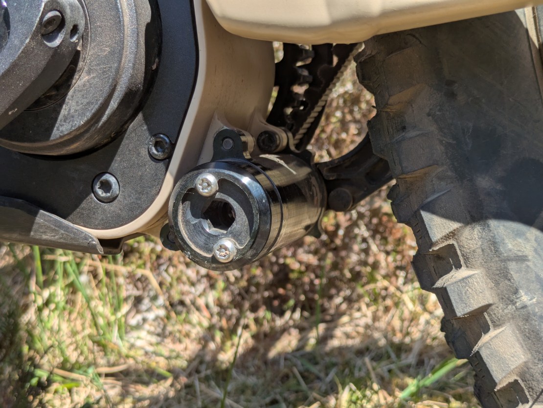 Close-up view of the Pinion MGU gearbox motor integrated with the Moustache Clutch bike, showcasing the drive mechanism and surrounding components.
