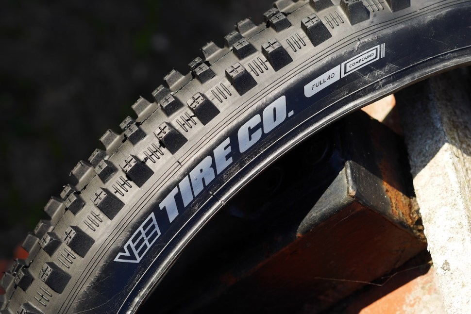 Close-up of a Vee Tire Co mountain bike tire showcasing the tread pattern and branding.