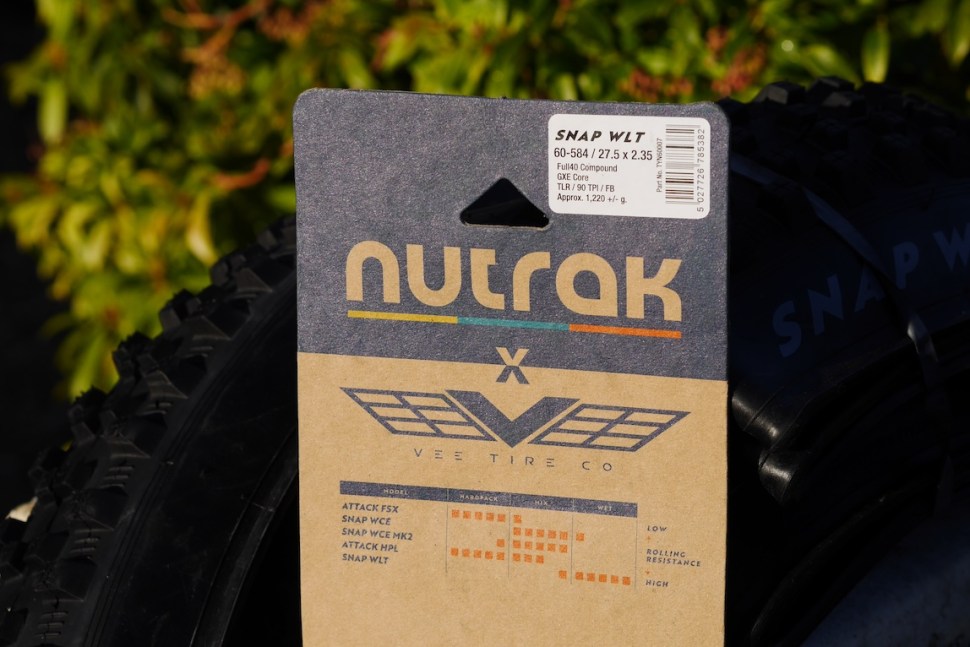 Close-up of a Nutrak x Vee Tire Co Snap WLT tire packaging, featuring product specifications and branding.