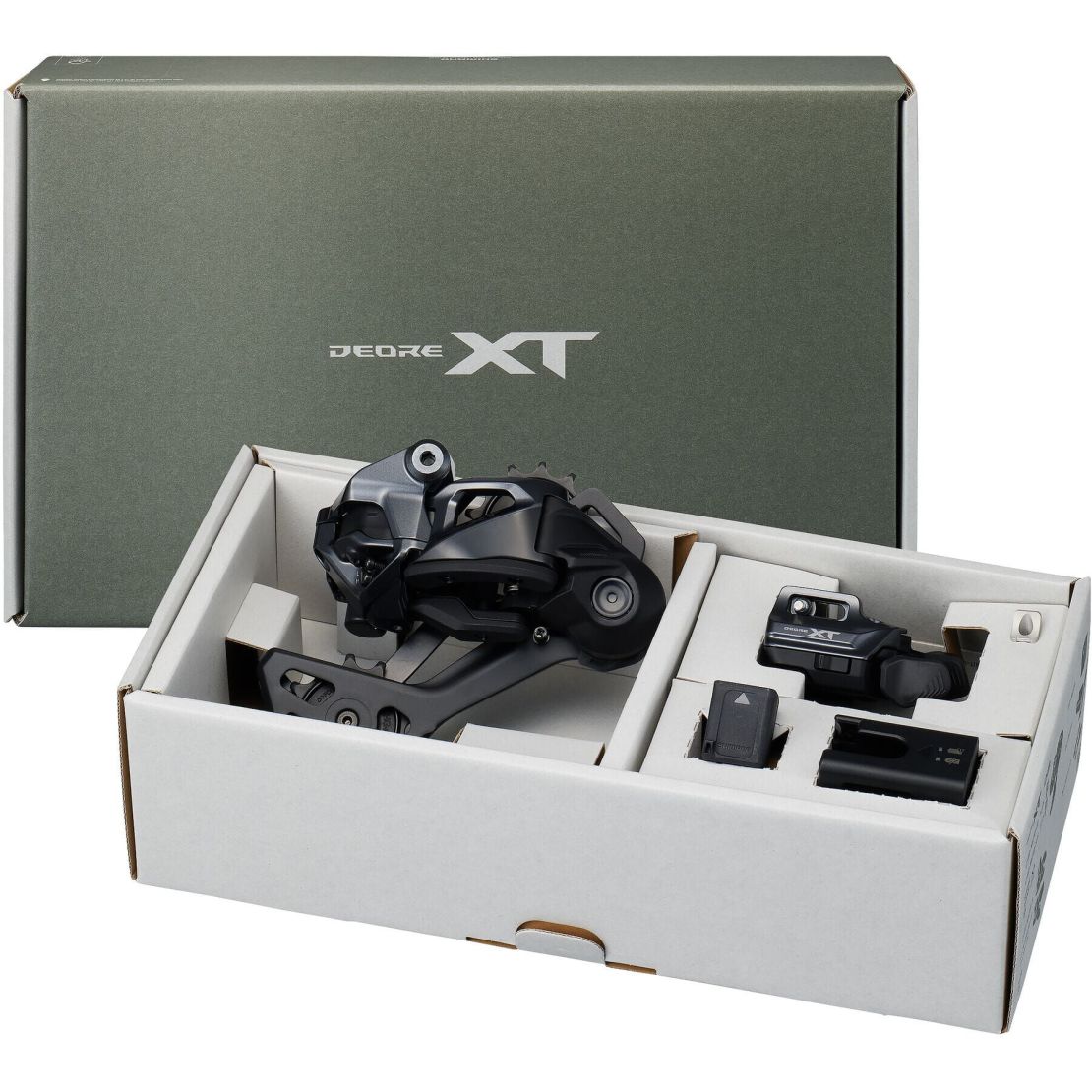 A Shimano XT Di2 upgrade kit displayed in an open box, featuring the rear derailleur, shifter, battery, and charger.
