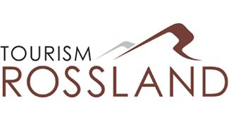 Logo for Tourism Rossland, featuring a stylized mountain design in brown and white.