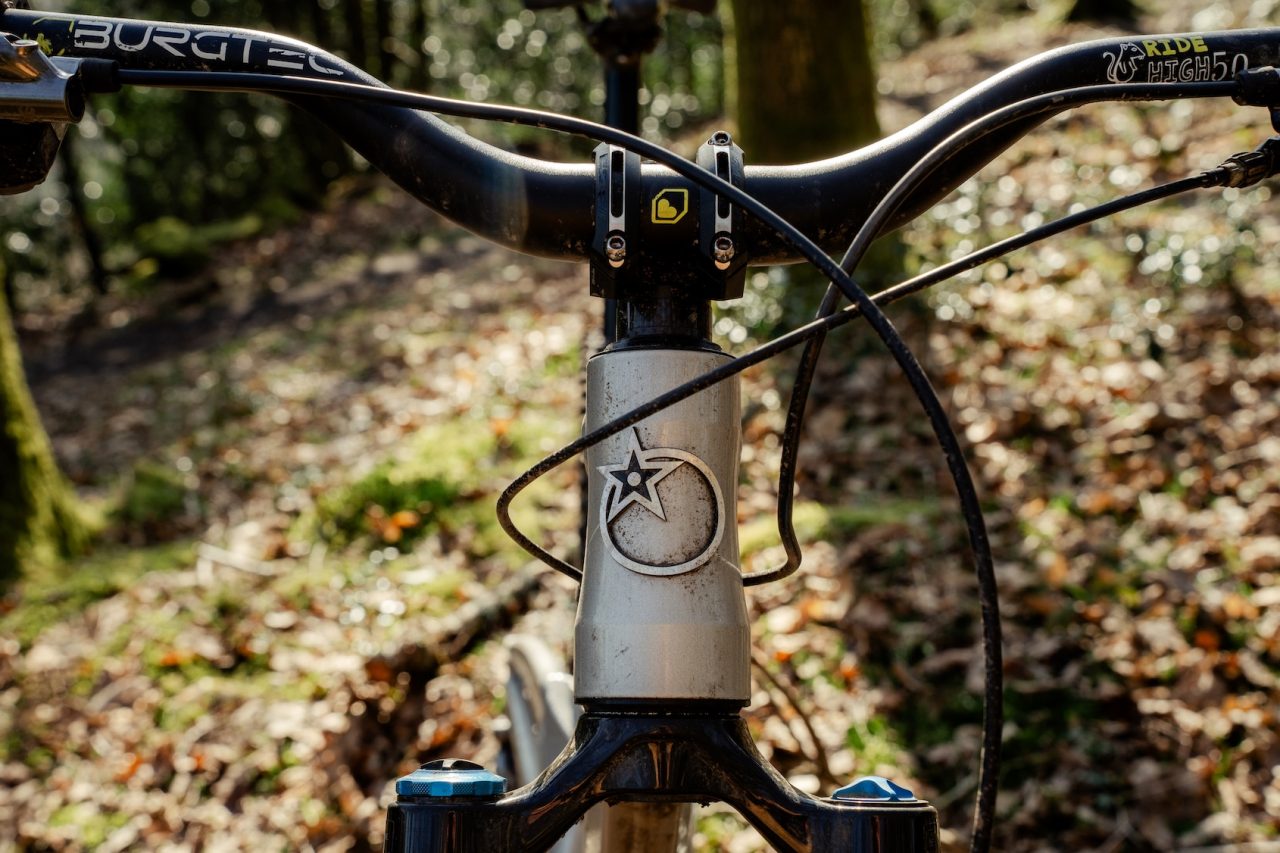 Orange Stage 6 parked on trail showing full frame profile