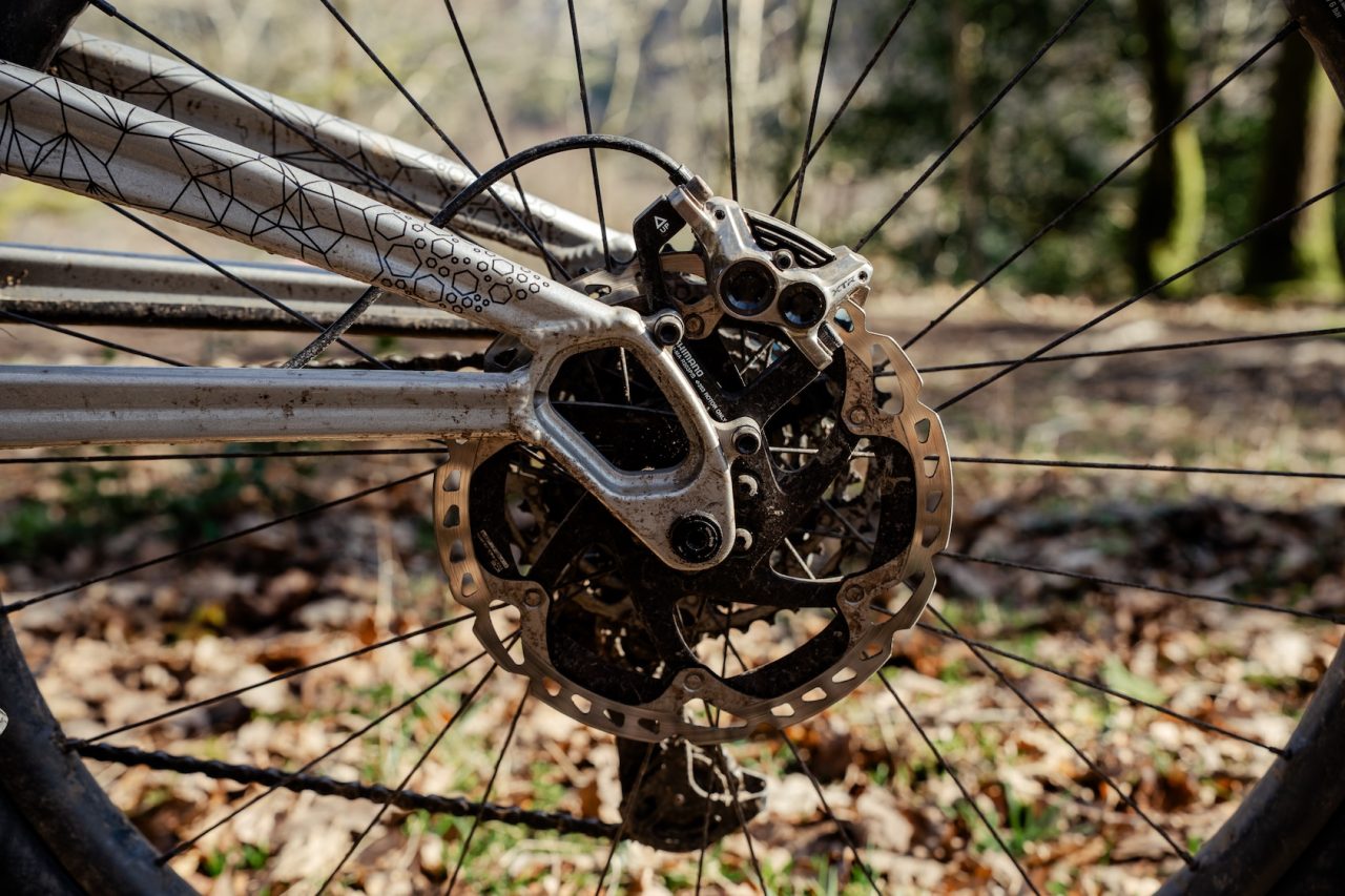 Orange Stage 6 full bike shot on trail showing 29er wheel size