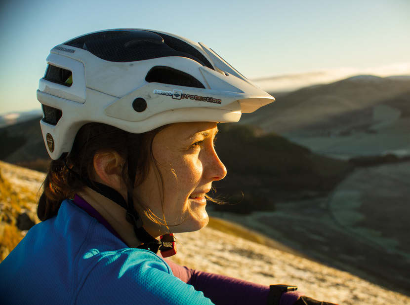 Katy Winton at speed on a woodland trail in the Tweed Valley
