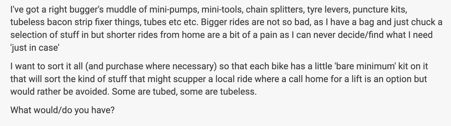 A collection of cycling tools and repair items including mini-pumps, mini-tools, chain splitters, tyre levers, puncture kits, and tubes, organised for convenience during short rides.