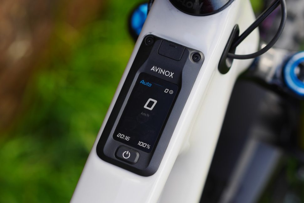 Close-up of a bicycle display unit showing speed, time, and battery level.