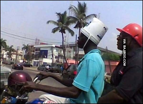 funny-man-bucket-helmet-on-bike.jpg